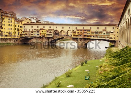 Beautiful sunset over of the oldest bridge over the river Arno in Florence Ponte Vecchio