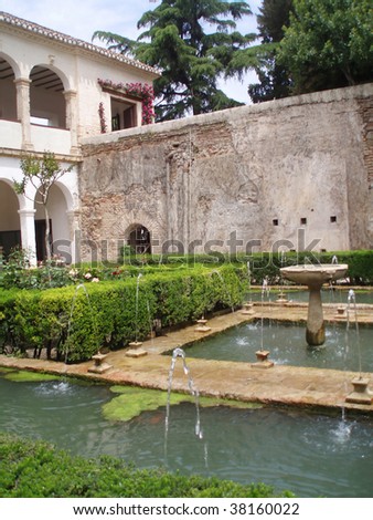 Paradise on the Earth - ancient palace of Alhambra with gardens in Granada, Spain