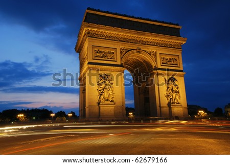 Beautifluly lit Triumph Arch at night. Paris, France.