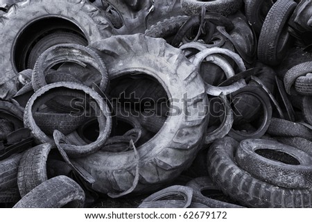 Heap of old torn used automobile tyres