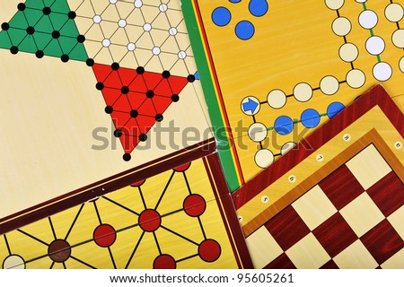 Various board games of ludo, halma, chess and fox and geese