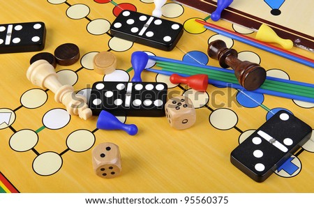 Various board games and many figurines background