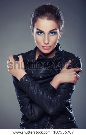 beautiful young woman with bright make-up and leather jacket