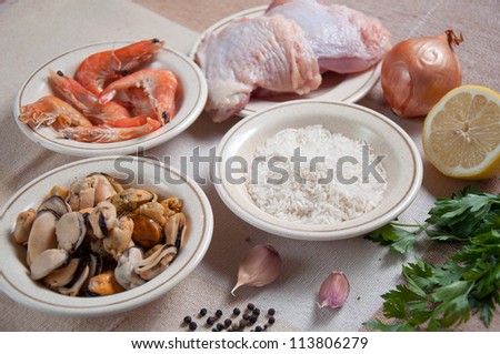 Ingredients for Paella ready meal with shrimp, chicken