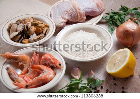Ingredients for Paella ready meal with shrimp, chicken
