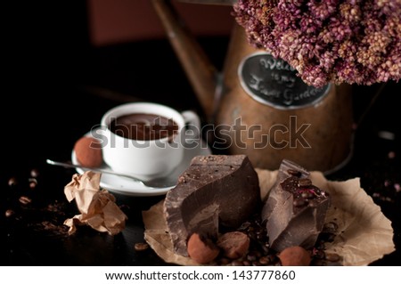 piece of chocolate bar  with hot chocolate drink
