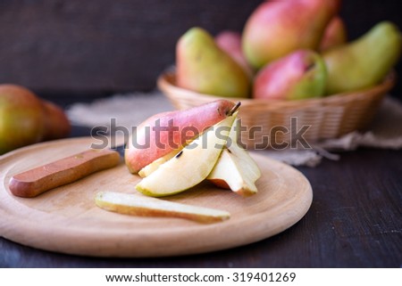 Delicious pears on a rustic wooden kitchen table