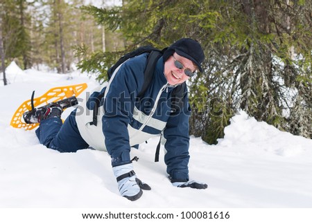 Woman falling down with a snowshoes and it\'s still funny.