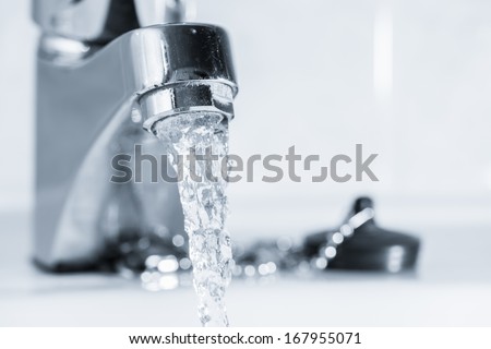 Open Faucet In Bathroom, Water Is Running, Tinted Black And White Image, Horizon Format