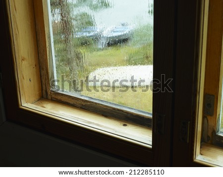 Rain and moisture condensation at the window, old structure