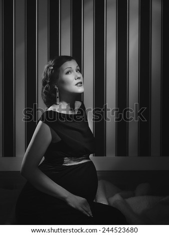 Hollywood black and white, a beautiful pregnant woman - minimal lighting and strong contrast