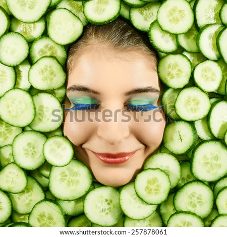 Beautiful woman expression face with cucumber slice frame