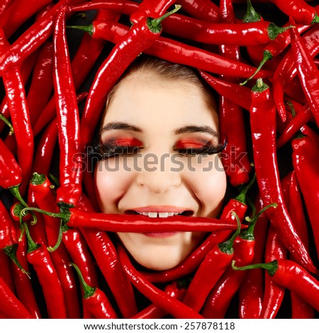 Beautiful woman expression face with red chili pepper frame