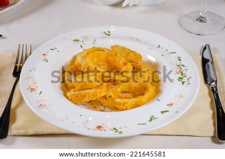 Looking Down at Bowl of Onion Rings at Fancy Table Setting