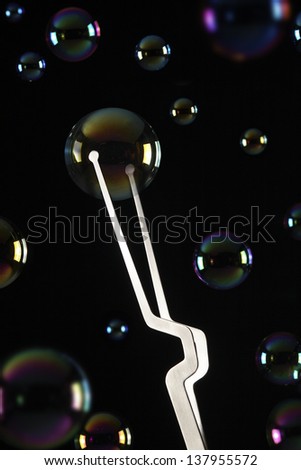 take a bubble with  kitchen tongs