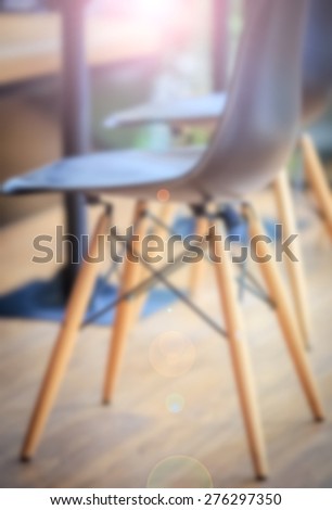 Black modern chairs in cafe shop light Fair texture background