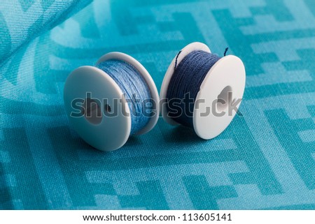 Blue thread on blue fabric with geometric pattern. Fabric my own design.