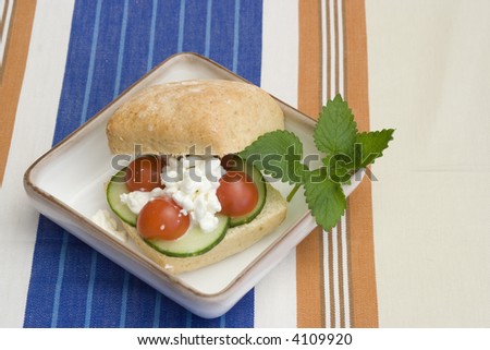 A healthy breakfast bun on a square plate