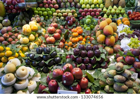 Various colorful fruits and vegetables at market La Boqueria in Barcelona