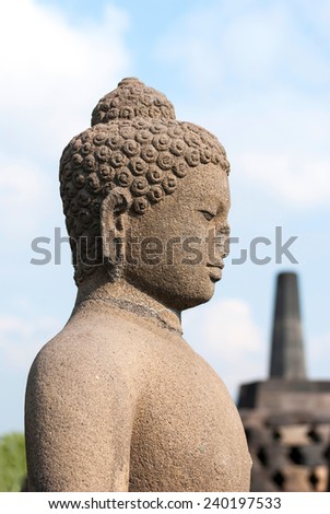 Buddha with stufa detail at Borobudur temple, Yogyakarta, Indonesia