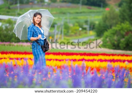 Thai lady in the flowers garden