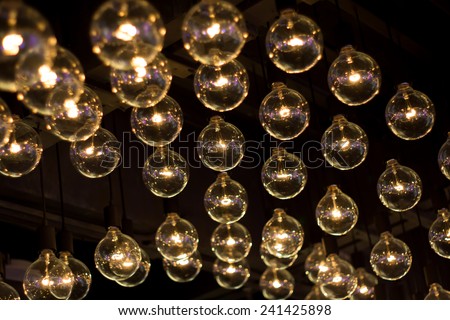 electric lamps hanging on the ceiling in the dark room