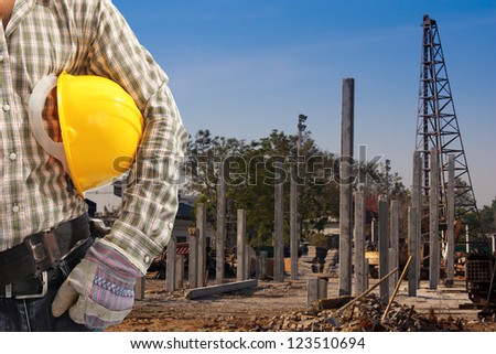 Pile driver  works to set precast concrete piles in a construction area