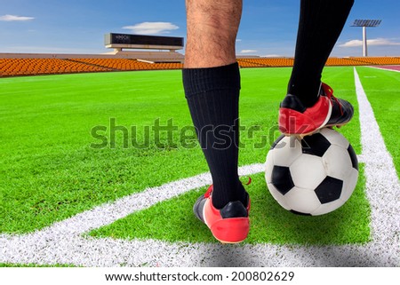rear view soccer player in a corner kick