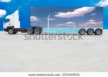 commercial delivery cargo truck container have advertising media about white wind turbine generating electricity on sea eco concept on blue sky background