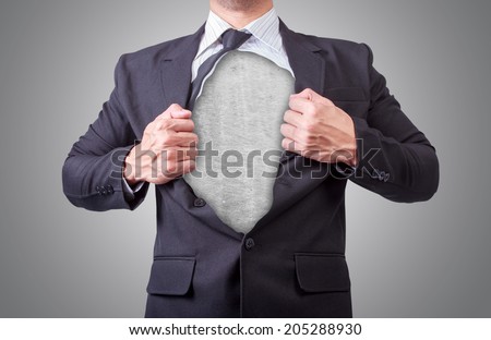 businessman acting like a super hero and tearing his shirt off showing a super hero suit underneath his suit body iron scratch made from scrap metal