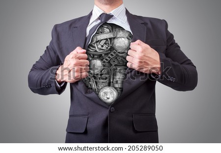 businessman acting like a super hero and tearing his shirt off showing a super hero suit underneath his suit body machinery made from scrap metal