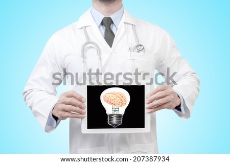 doctor presenting diagnosis brain inside a light bulb in digital tablet screen concept for medical for creative thinking