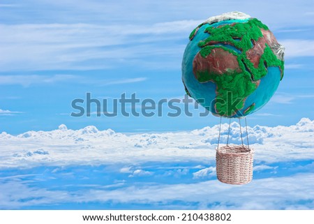 globe hot air balloon basket floating over the cloud in ecology concept against blue sky background