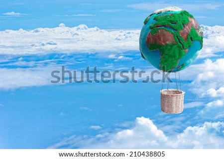 globe hot air balloon basket floating over the cloud against blue sky background in ecology concept