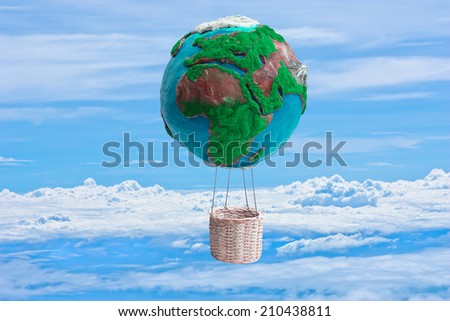globe hot air balloon basket in ecology concept against blue sky background