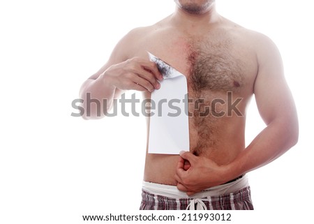 man waxing his chest to depilate hair isolated on white background with clipping path