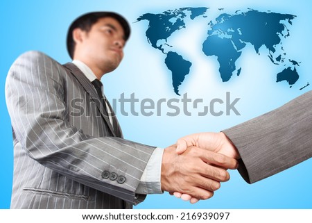 business handshake at meeting against map world partnership global concept