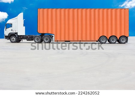 commercial delivery cargo container truck against blue sky background