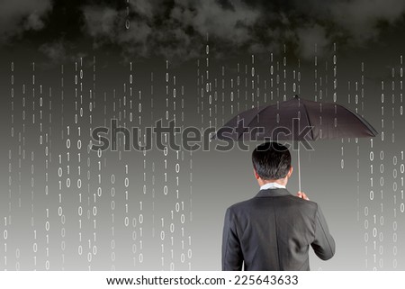 rear view Businessman with an umbrella among binary code digital rain storm antivirus and firewall protection concept