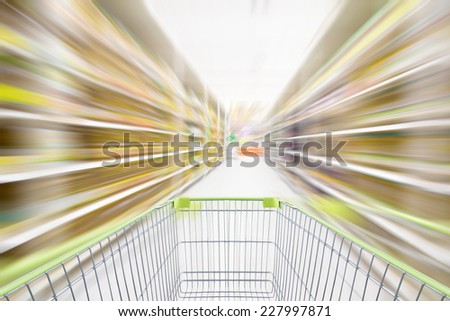 Shopping in supermarket by Shopping cart in motion blur