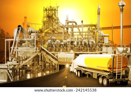Truck with fuel tank on the highway into factory and beautiful sunset sky in concept of industrial and agriculture