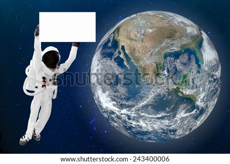 Astronaut holding blank banner for advertise floating in space and Earth background. Elements of this image furnished by NASA