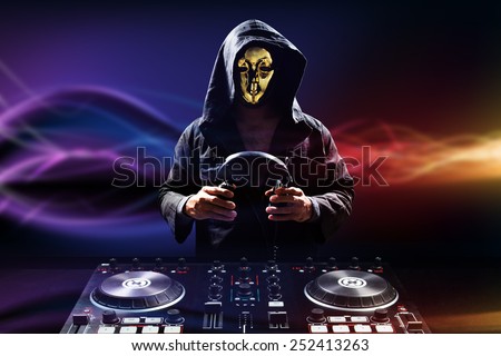 Anonymous disc jockey mixes the track turntable to play music dance in nightclub at party