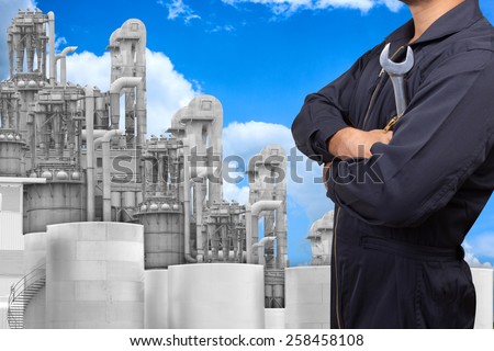 mechanic working for maintaining at petrochemical Industrial plant with blue sky