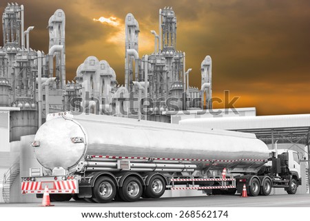 Tanker Truck to transport fuel on the road at refinery oil in sunset