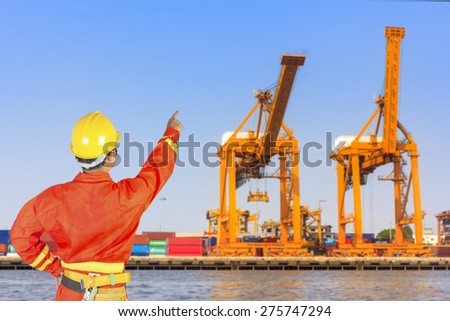 dock worker controlling work process in the harbor