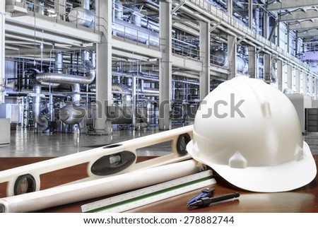 Engineer working table plan at equipments and machinery in a modern thermal power plant