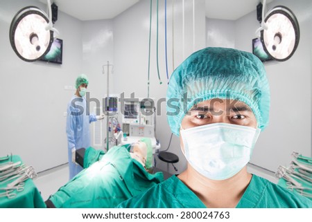 surgeon with team and equipment tools for surgeons in operating room