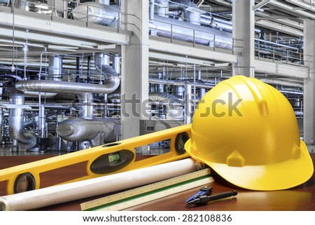 engineer working table and measure tape and level water tool equipment at modern thermal power plant