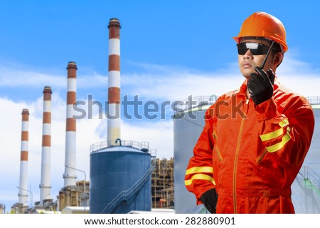 Engineer with radio communication in action for working at modern thermal power plants